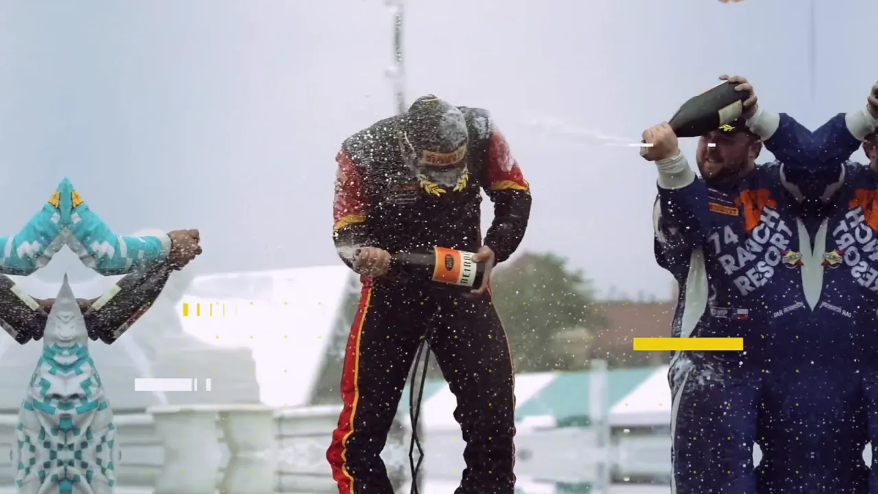 Detroit Grand Prix podium — drivers spraying champagne in the rain